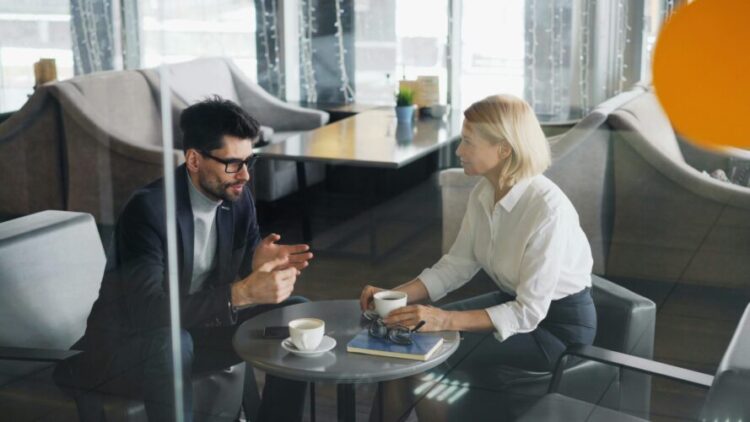 A man and woman sitting at a table